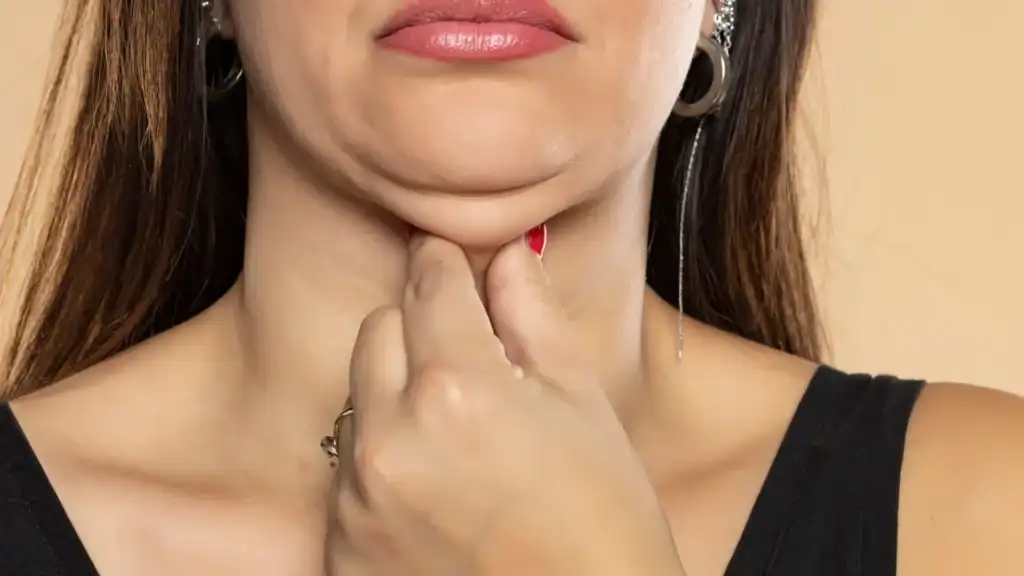 An image of a woman with double chin, sad, worried : Non Surgical Double Chin Removal Treatment in Livingston, UK